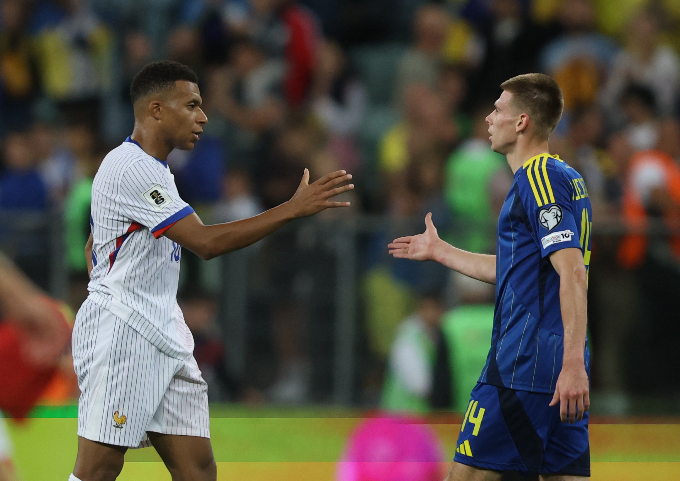 Kylian Mbappe with Oleh Ocheretko
